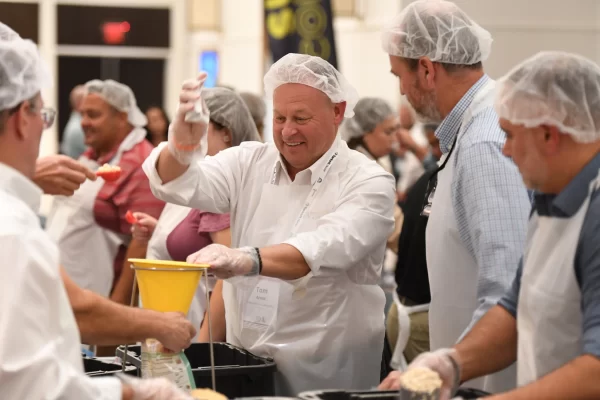 We Give Back - No Child Hungry food packing